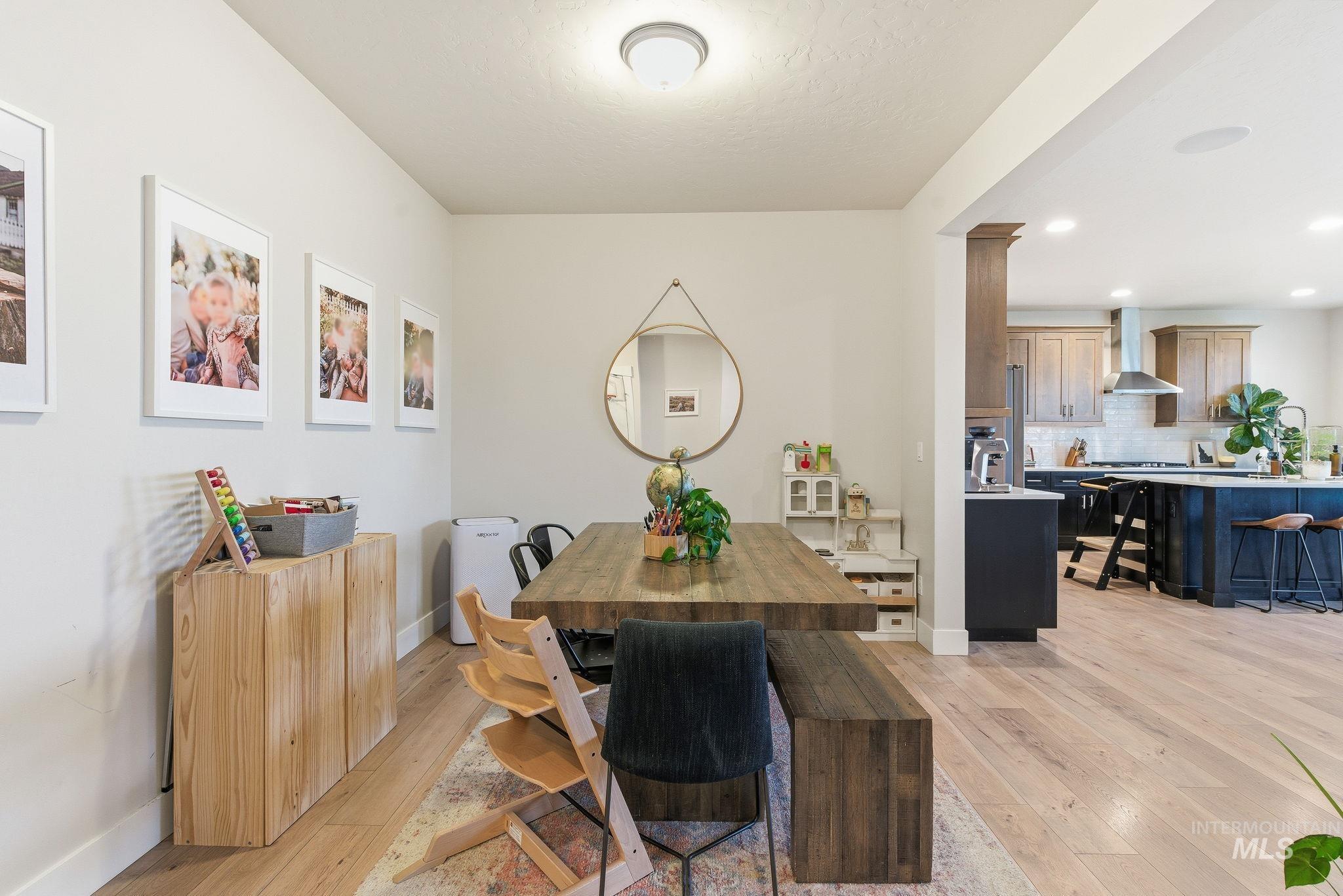 Dining room featuring light wood finished floors and recessed lighting