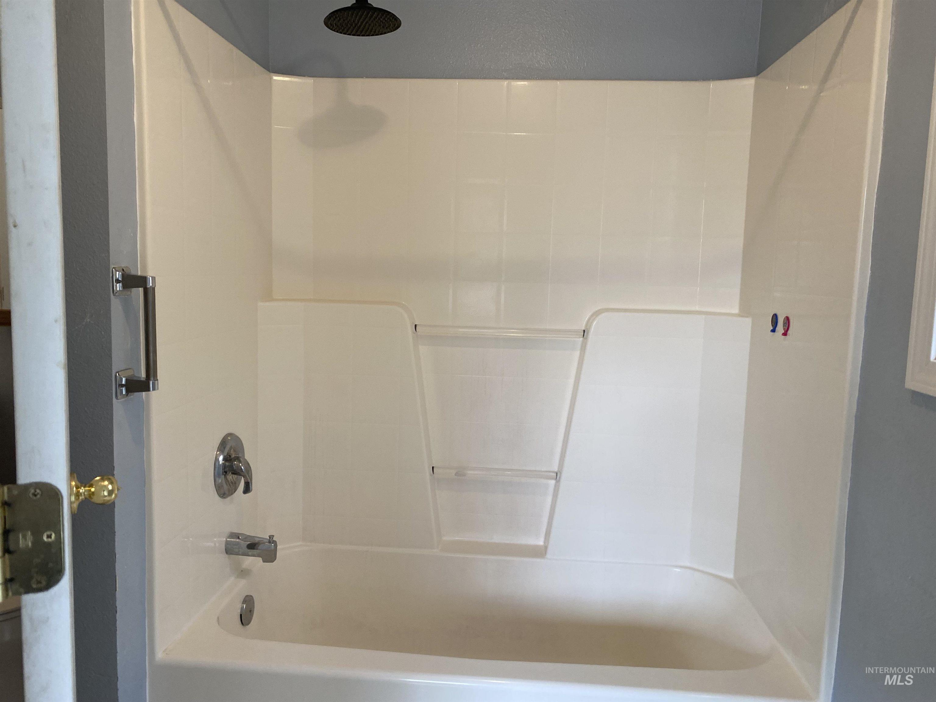 Full bath featuring  shower combination