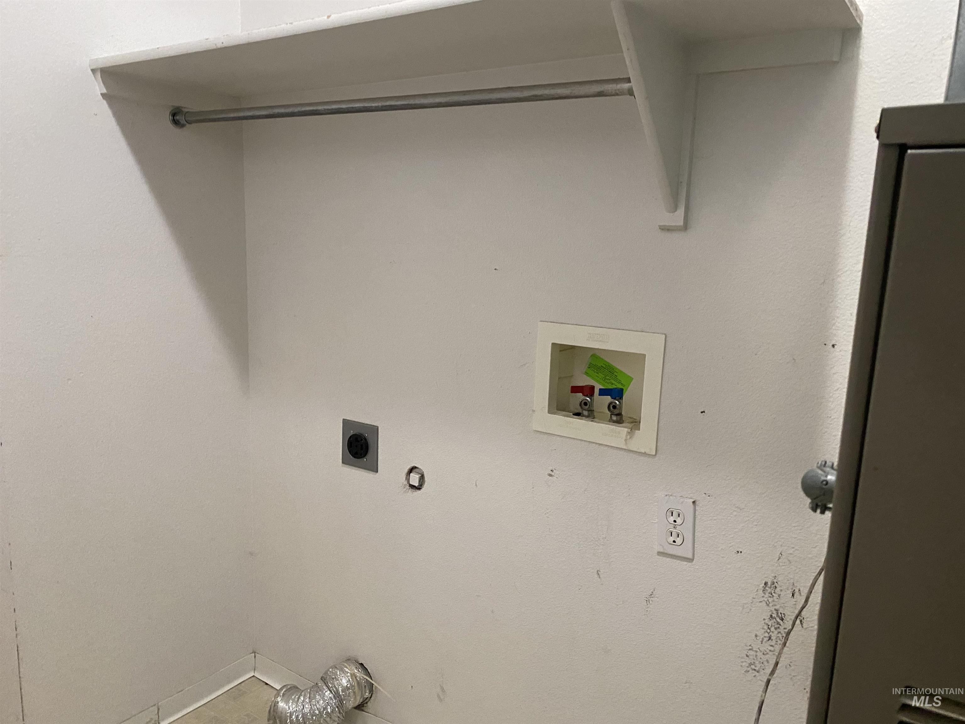 Laundry room with gas dryer hookup, hookup for a washing machine, and hookup for an electric dryer