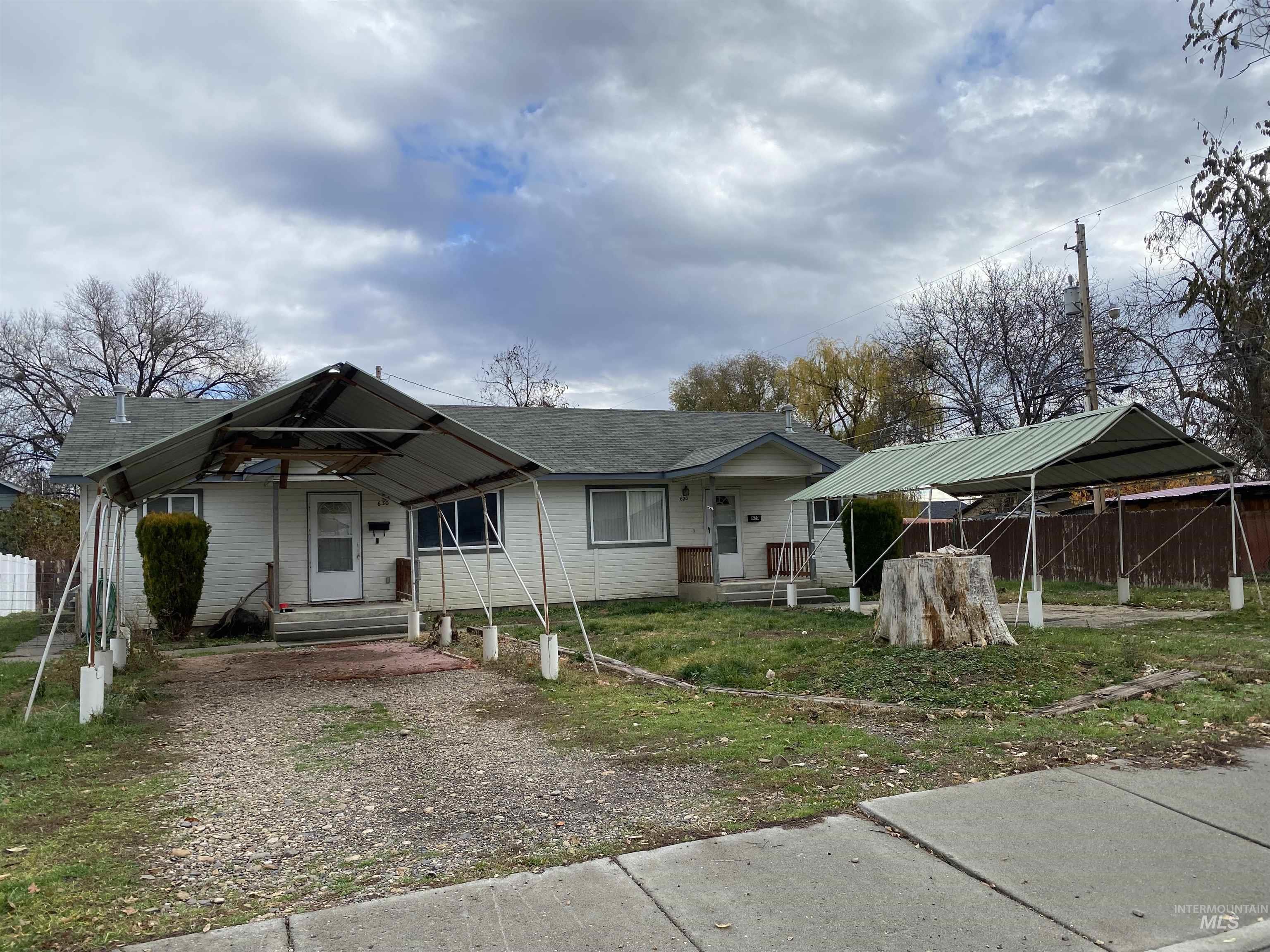 View of front of house featuring a shingled roof and a porch