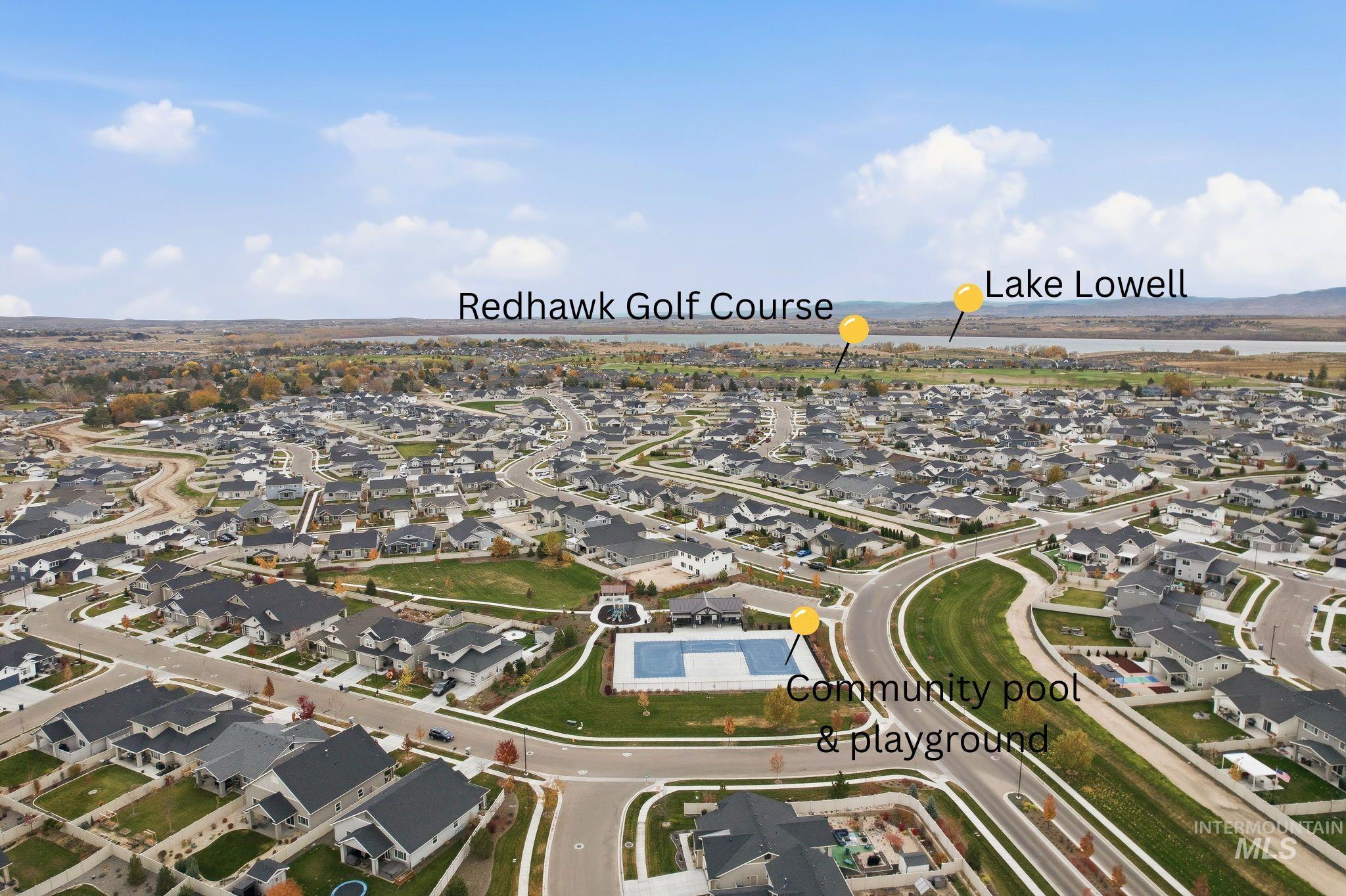 Aerial view of property's location featuring nearby suburban area and a large body of water