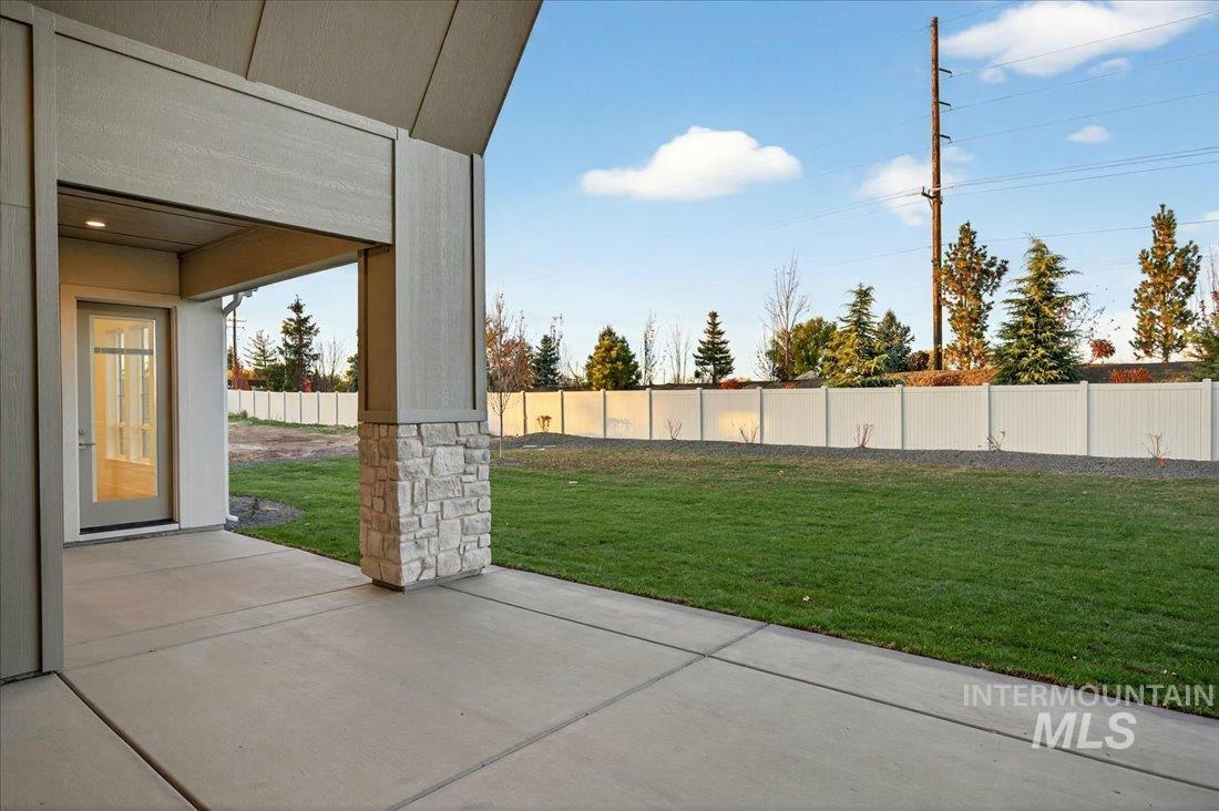 Fenced backyard with a patio area