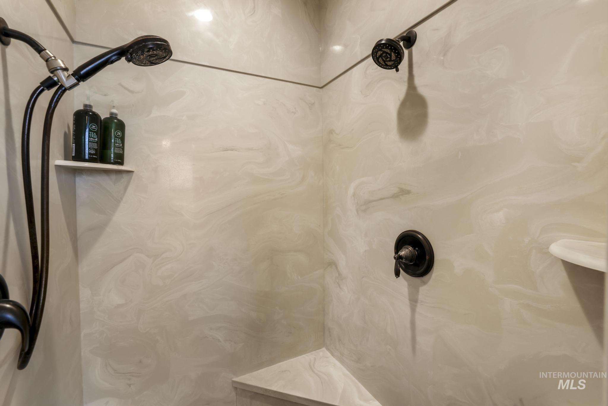 Bathroom view of a marble finish shower