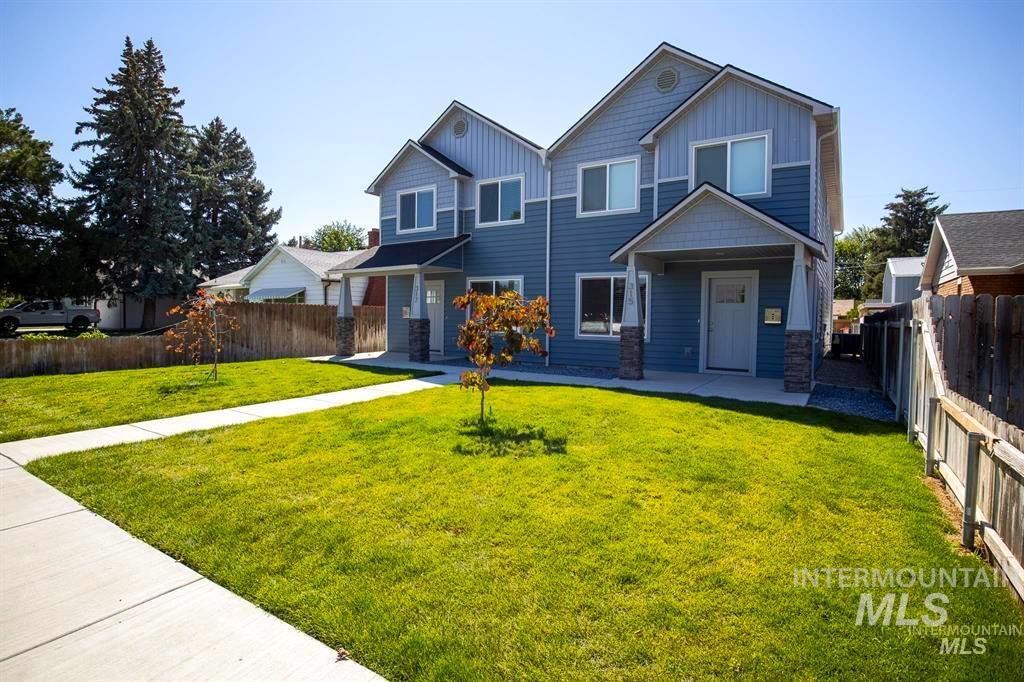 Craftsman-style home featuring board and batten siding, stone siding, and a porch