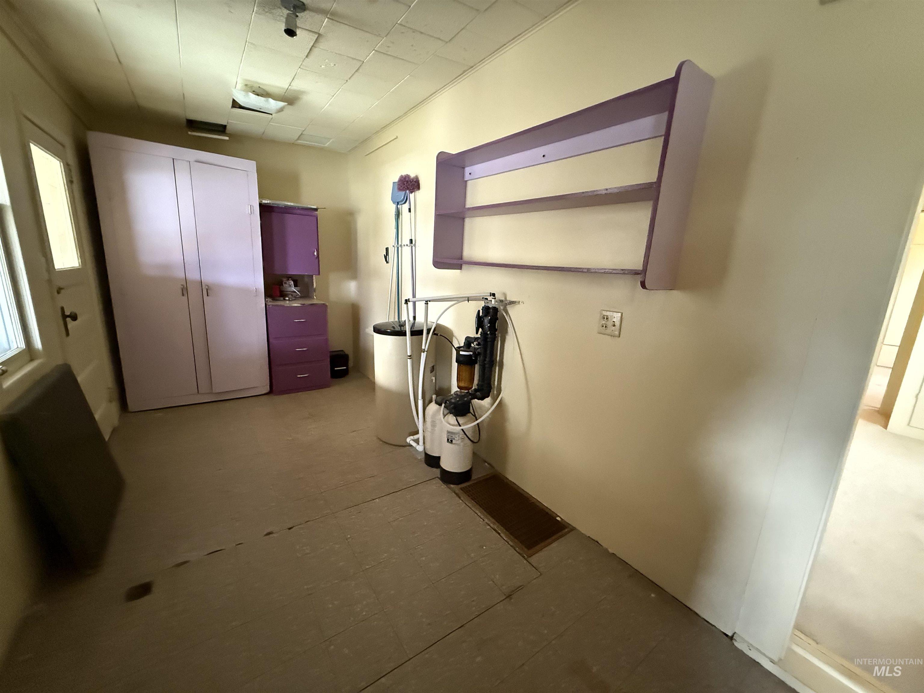 Corridor featuring dark flooring