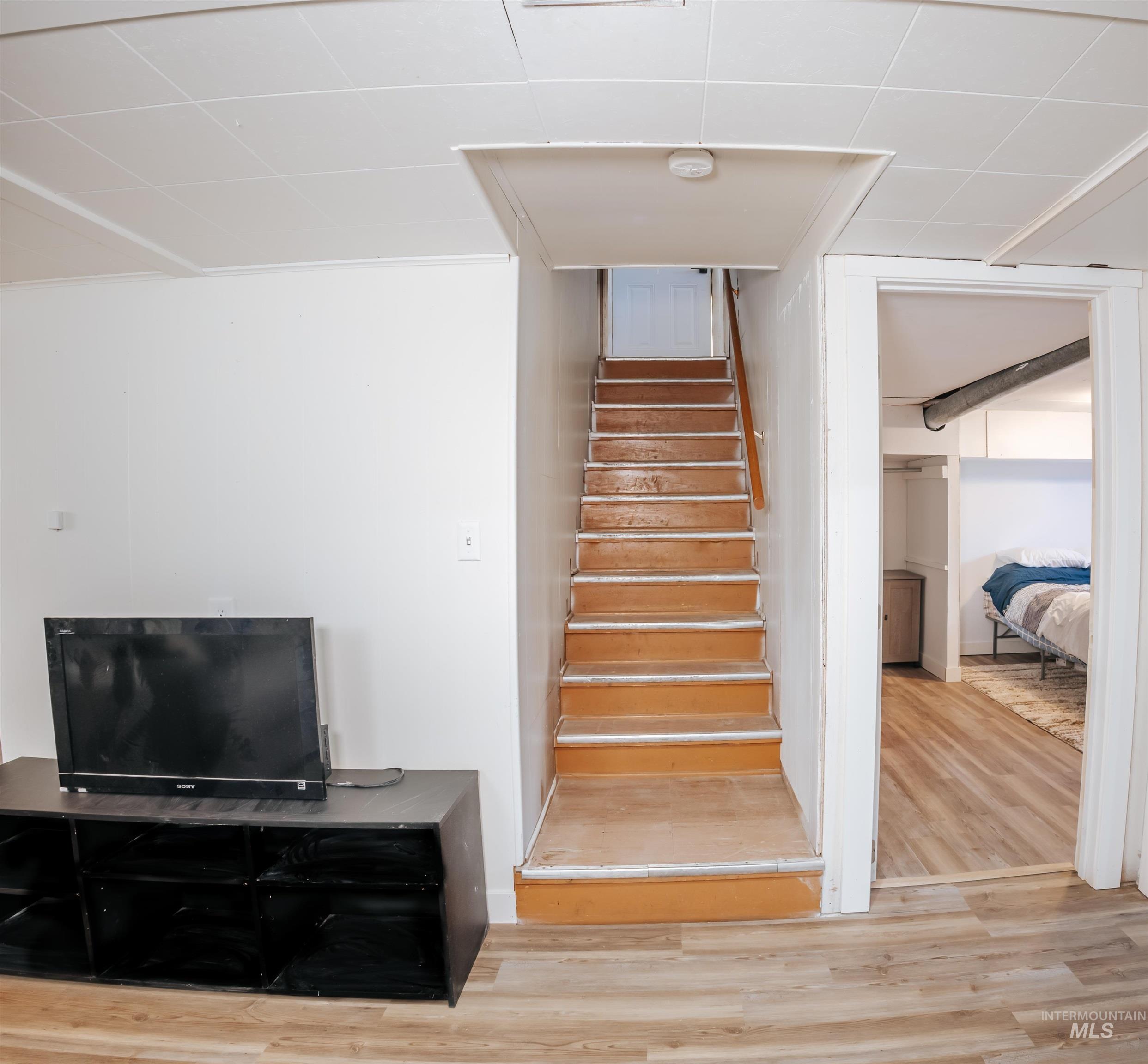 Staircase with wood finished floors