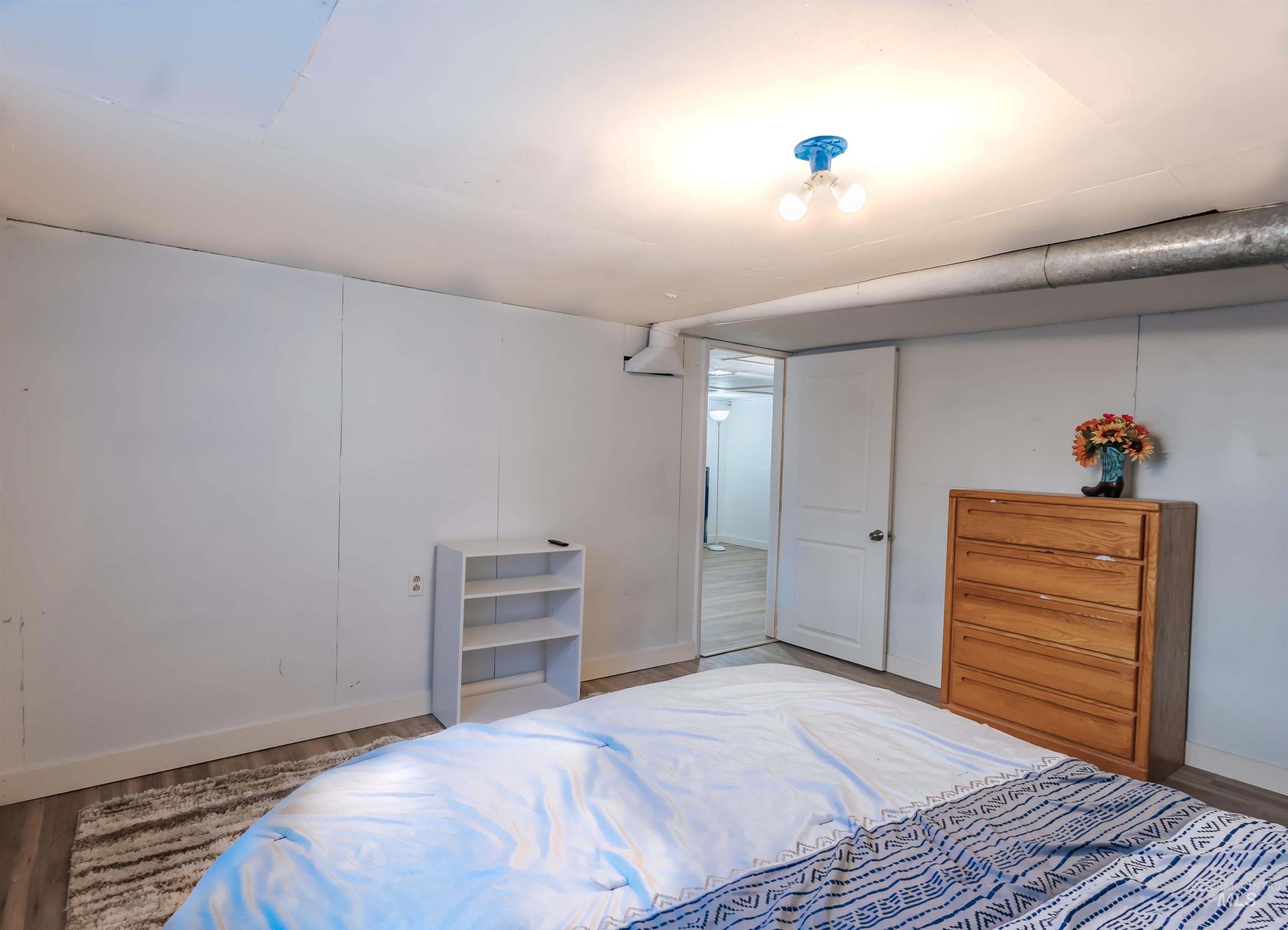 Bedroom with wood finished floors