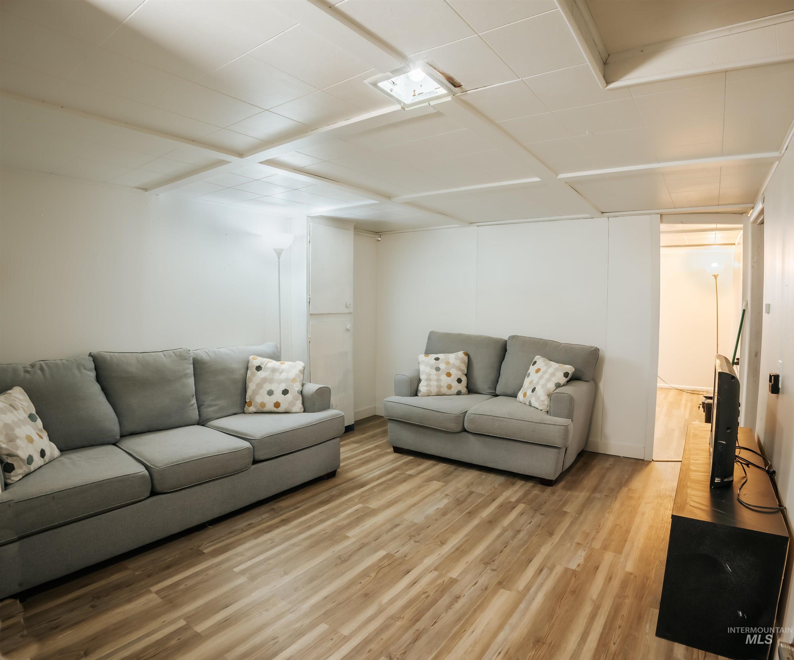 Living room with light wood-style floors