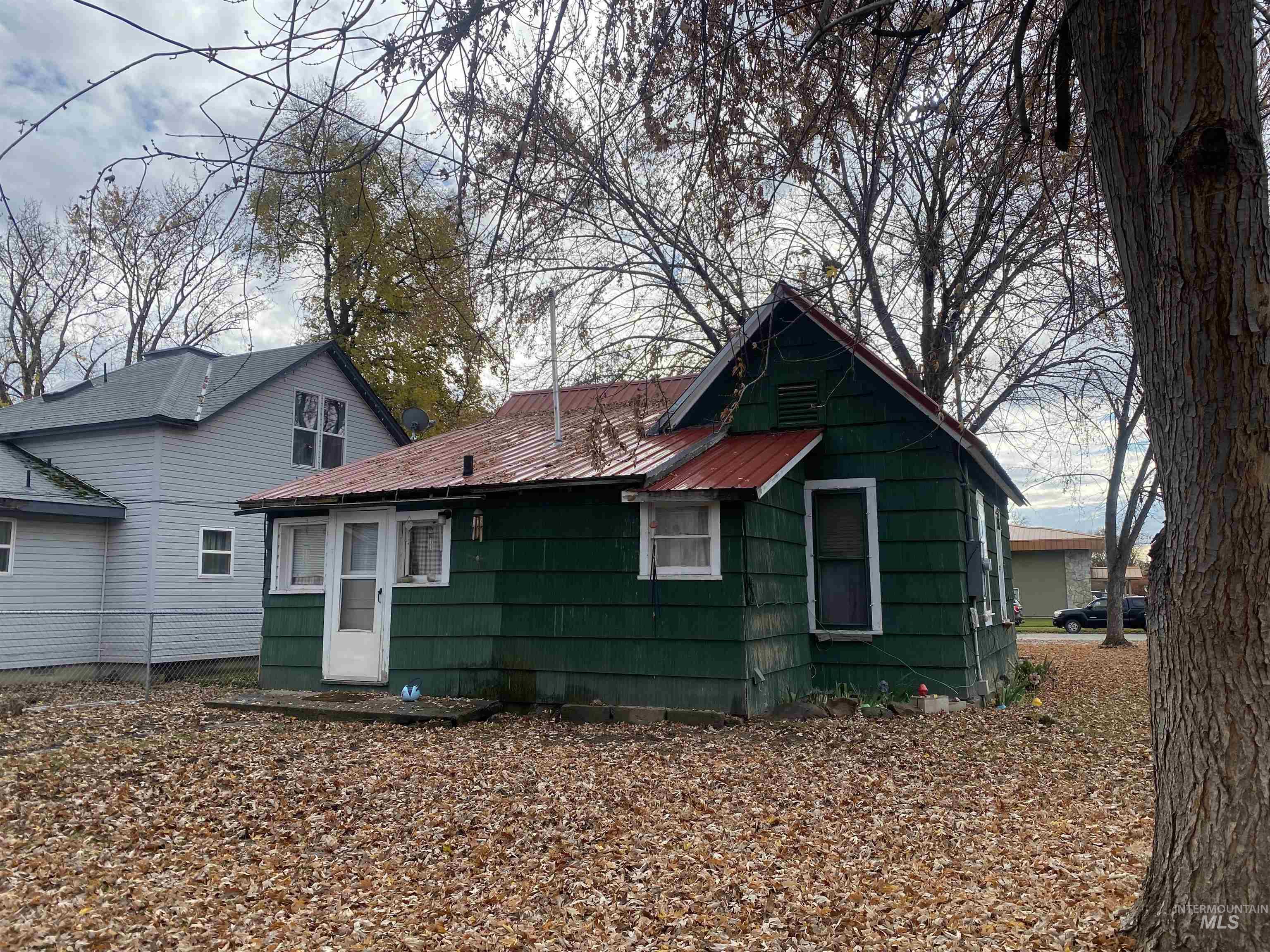 Rear view of property featuring a metal roof