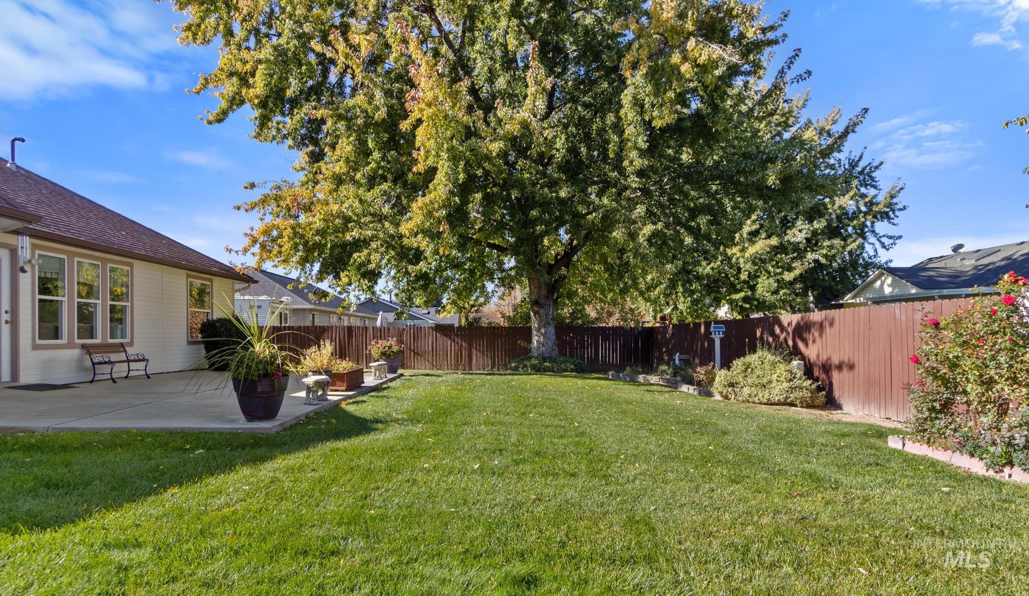 Fenced backyard with a patio
