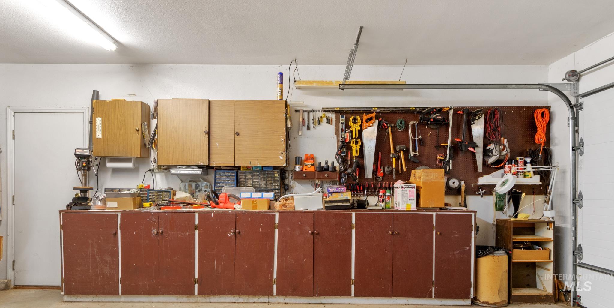 Garage featuring a workshop area