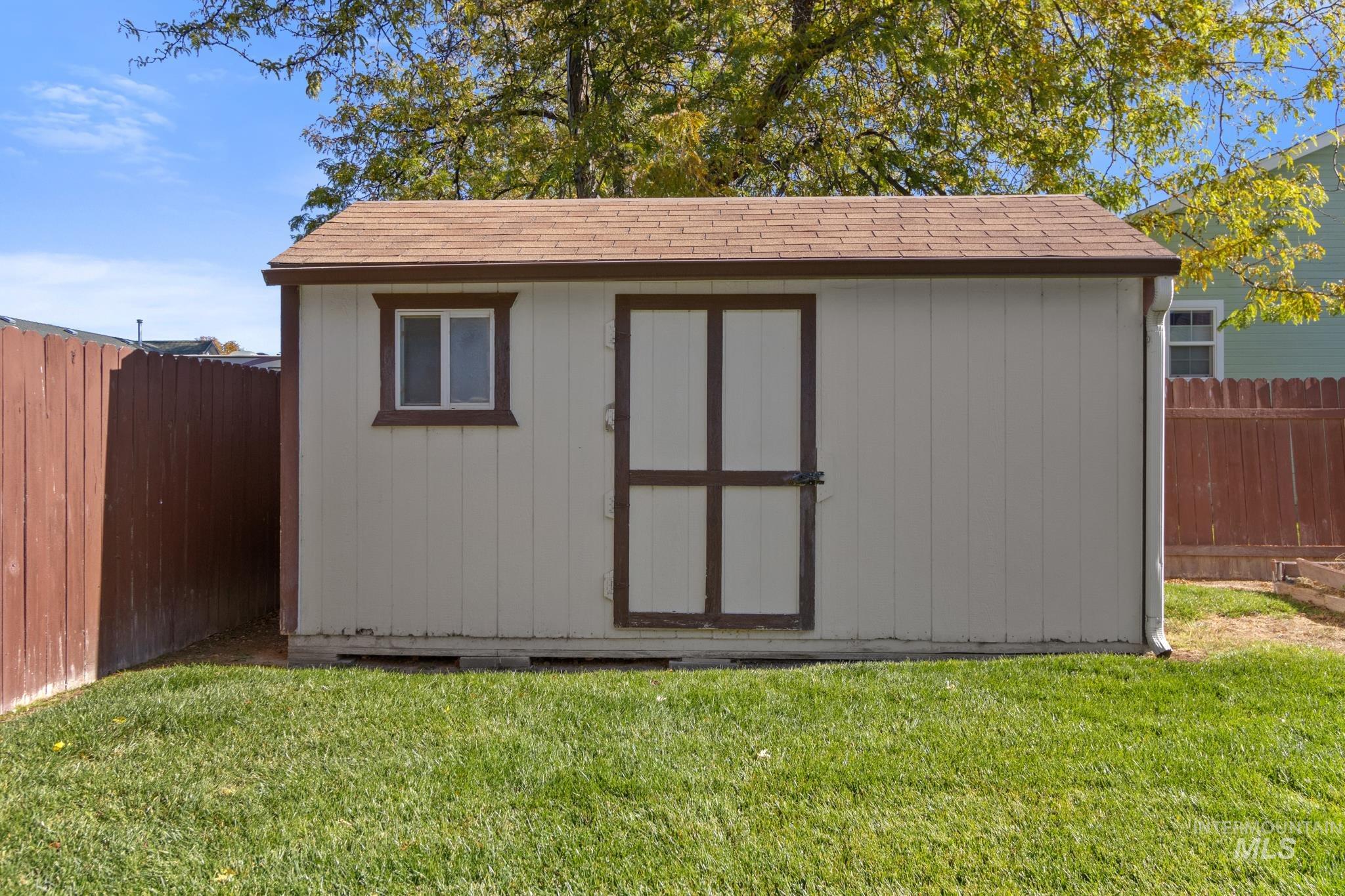 View of shed featuring a fenced backyard