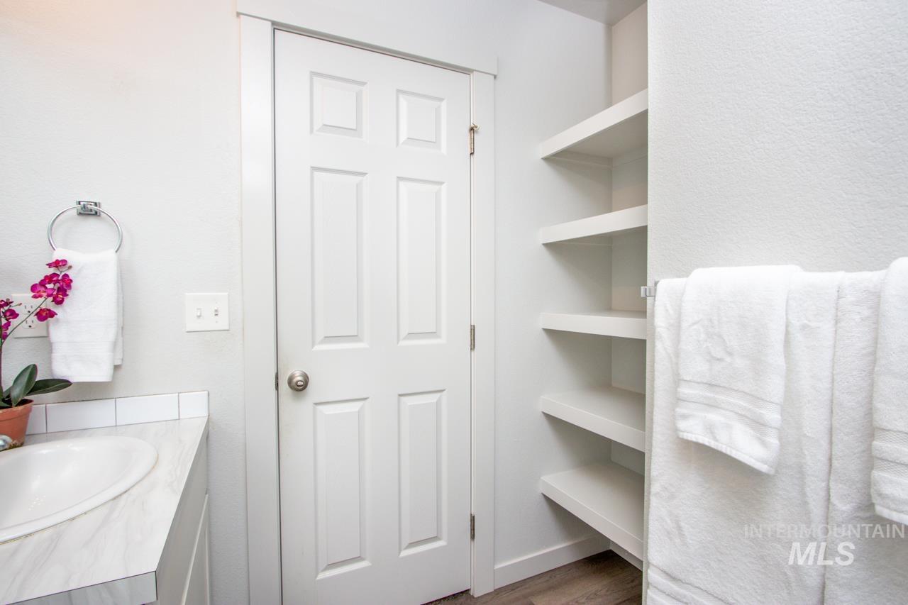 Bathroom with vanity and wood finished floors