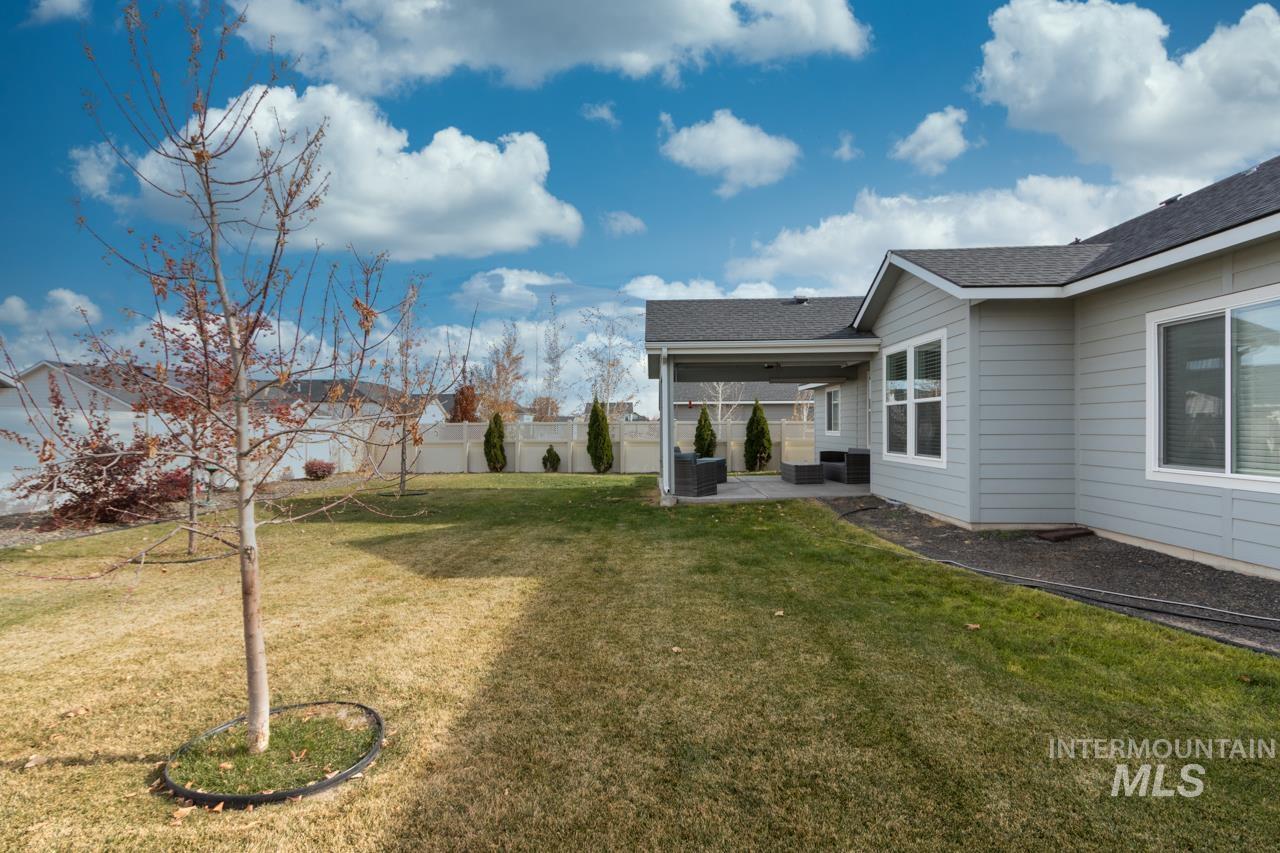 Fenced backyard featuring a patio
