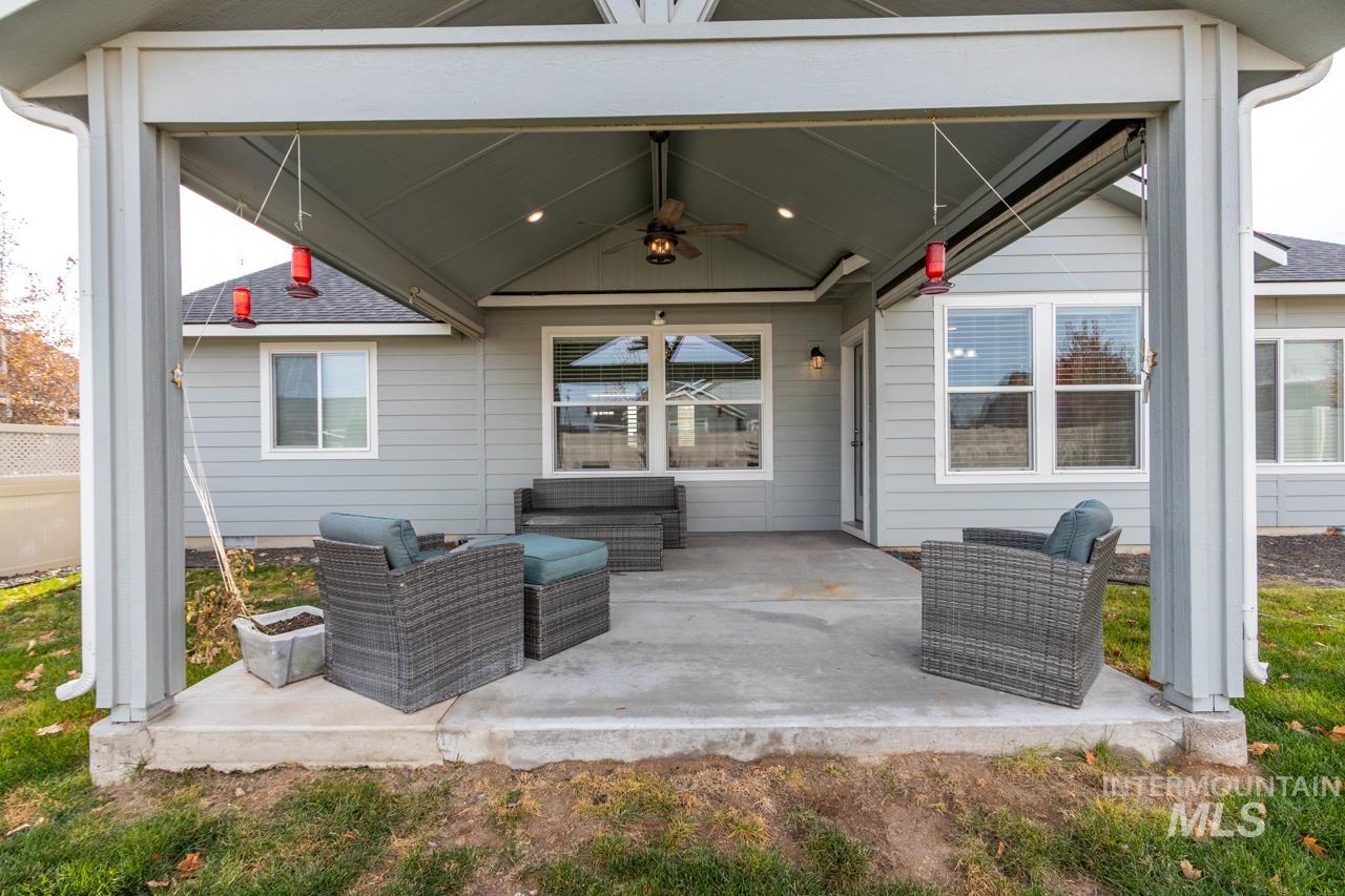 View of patio featuring a ceiling fan and outdoor lounge area