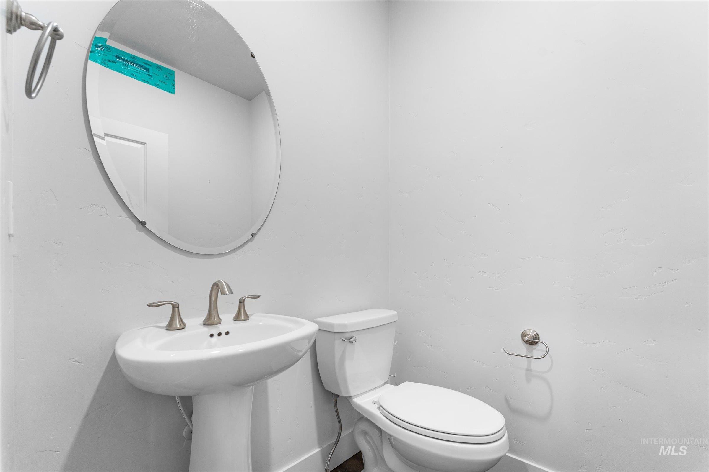 Half bath featuring baseboards