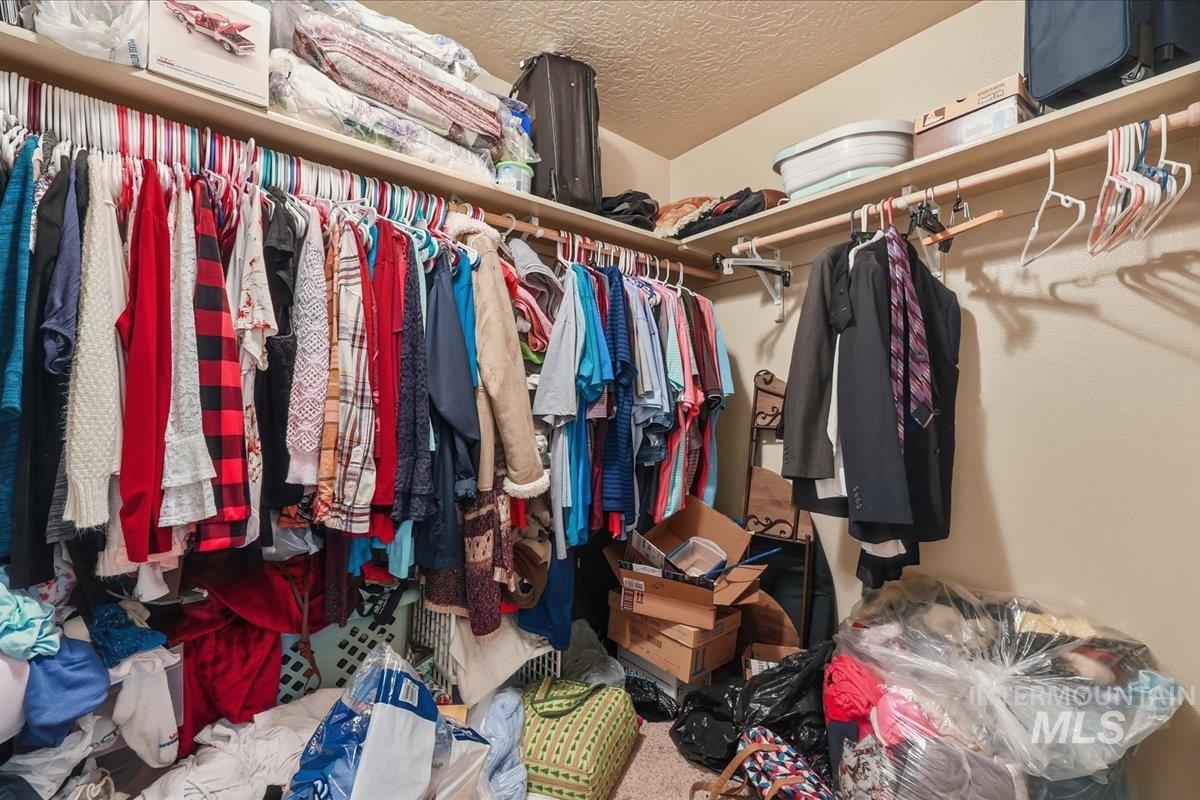 Walk in closet with carpet