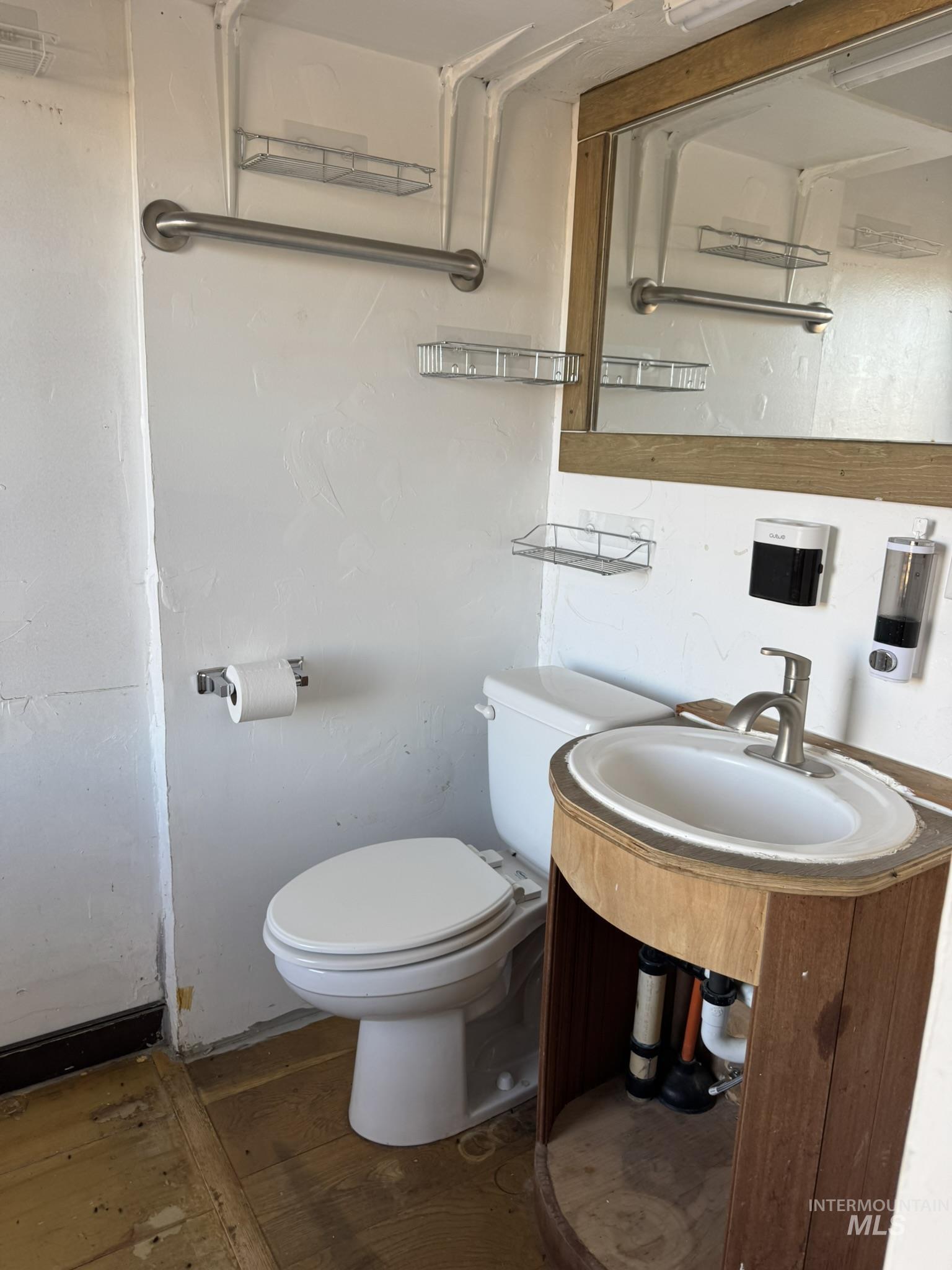 Bathroom with vanity and wood finished floors