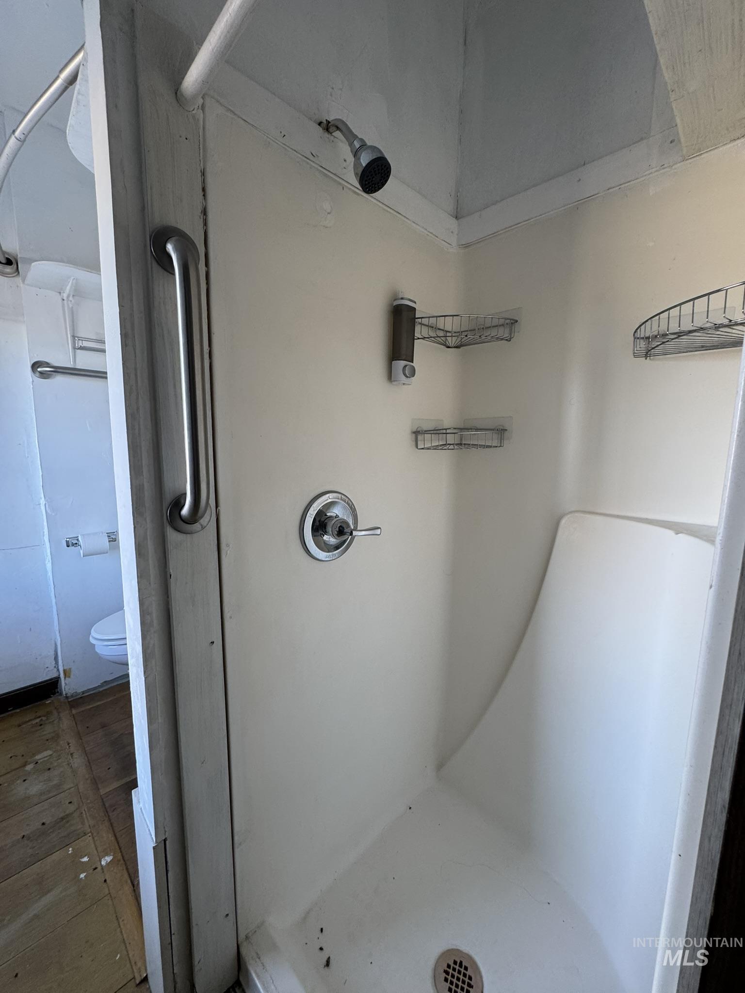 Bathroom featuring a shower stall