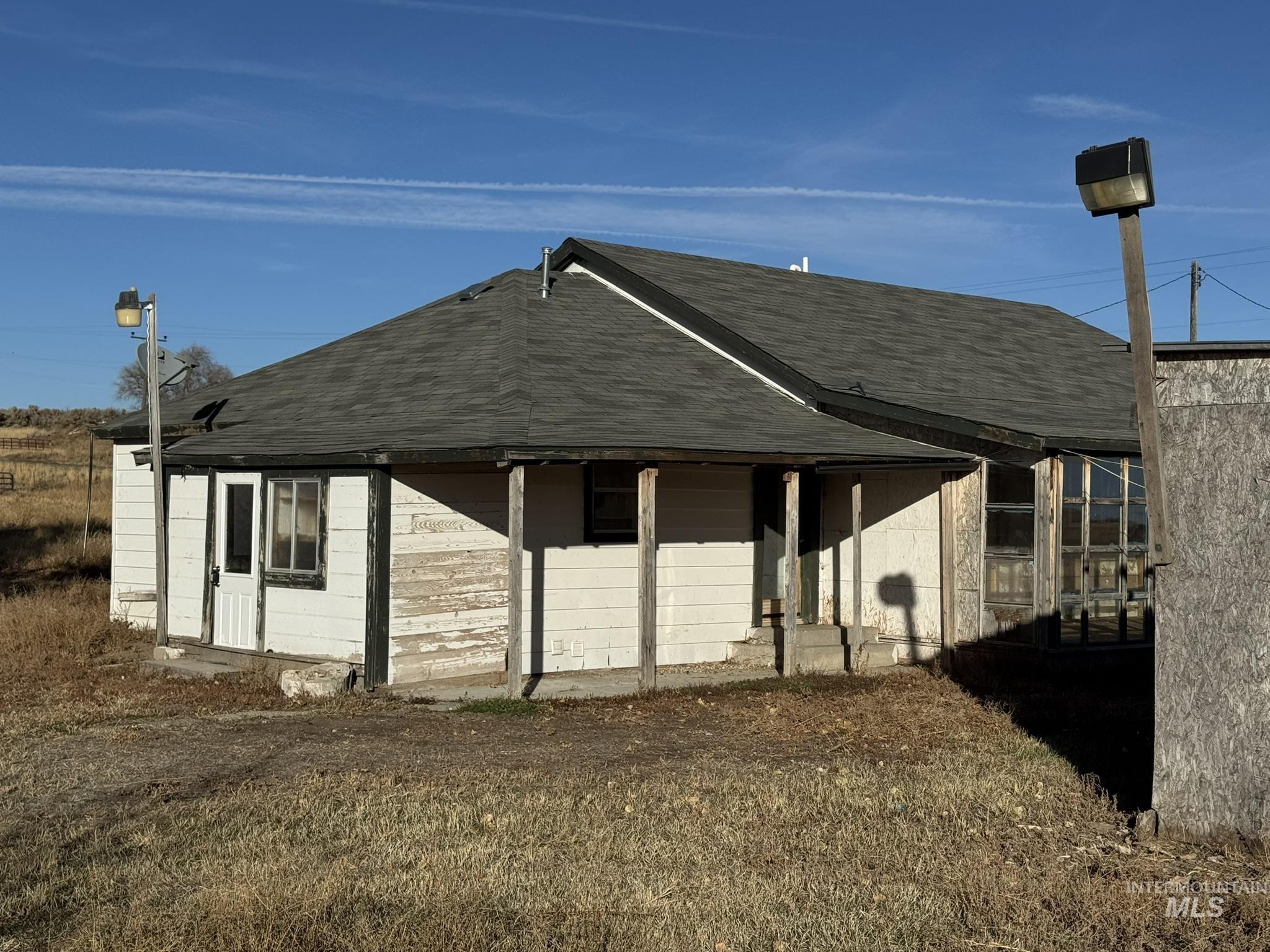 View of home's exterior featuring a shingled roof