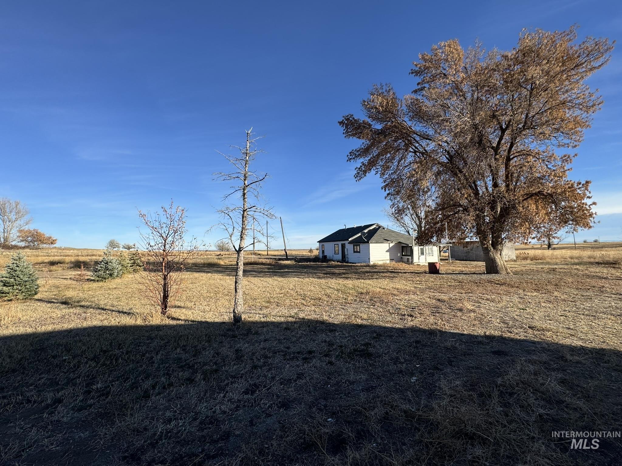 View of green lawn featuring a rural view
