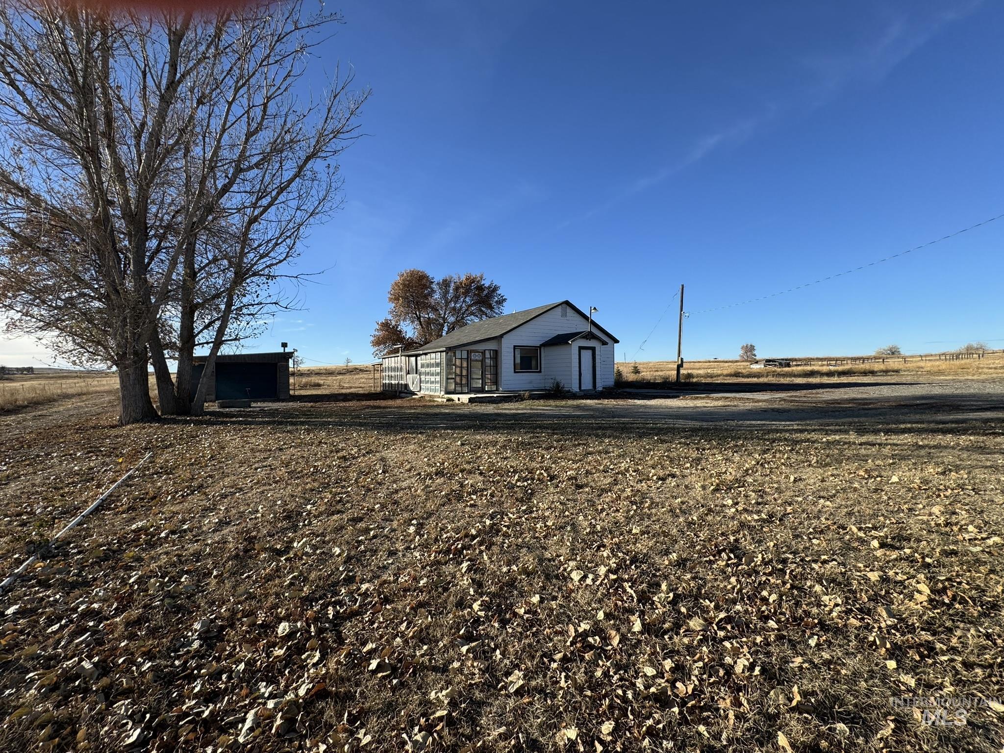 View of front of home featuring an outbuilding