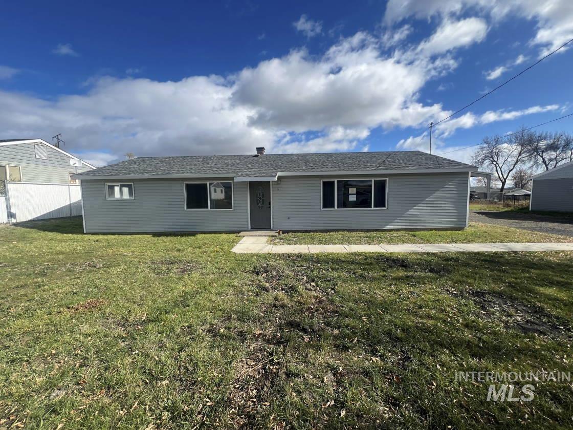 Ranch-style house featuring roof with shingles