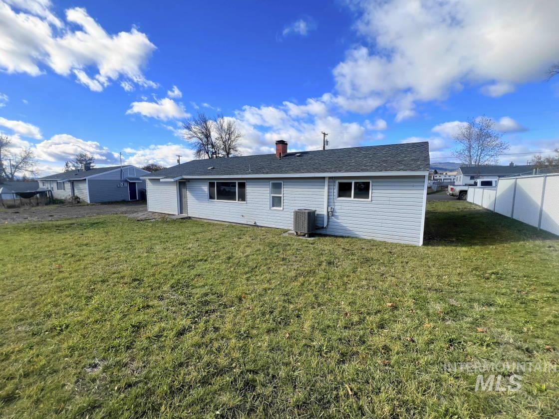 Back of property with a chimney