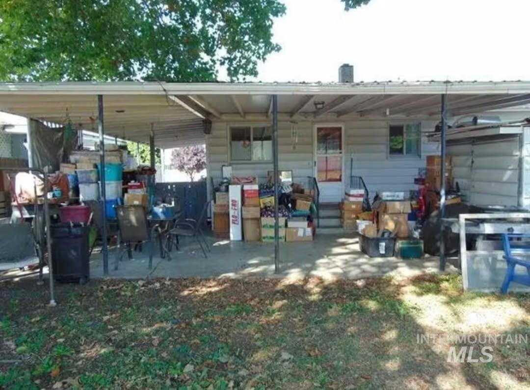 Back of house with a patio