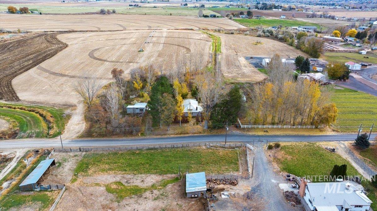 Aerial view of property's location with rural landscape and abundant farmland