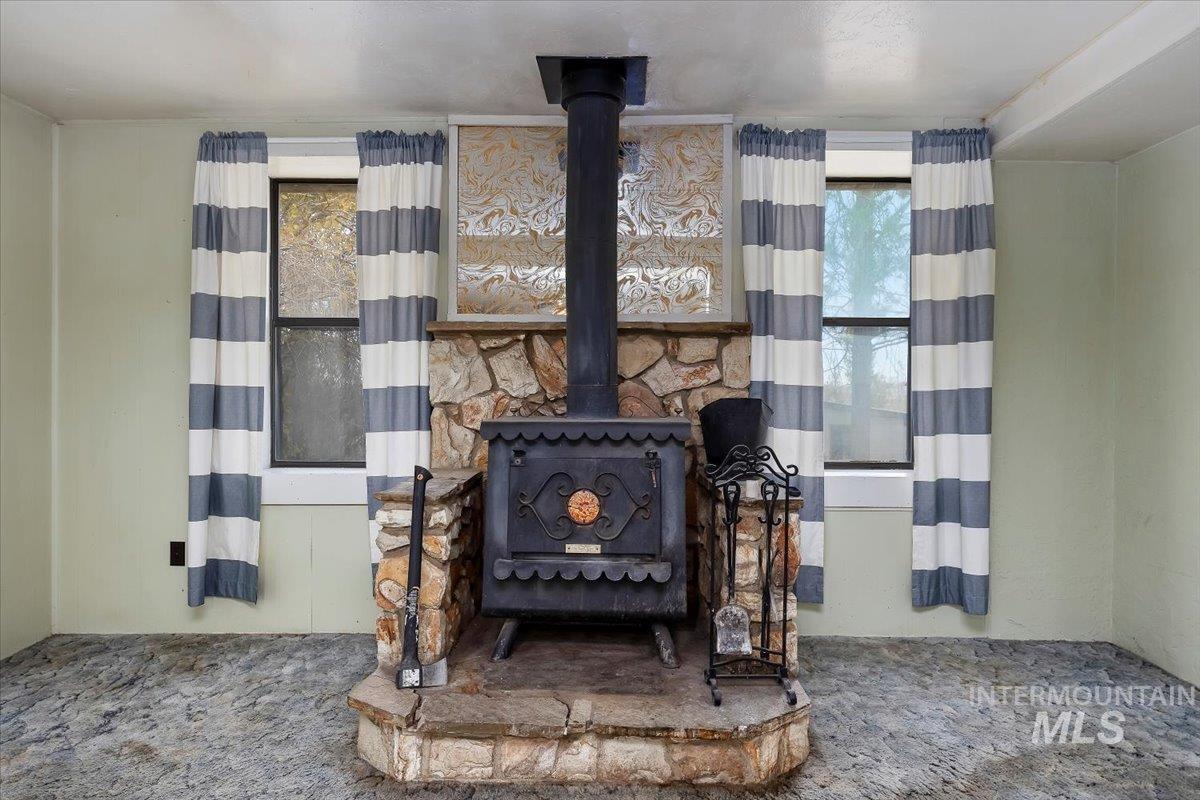 Detailed view of a wood stove and carpet floors