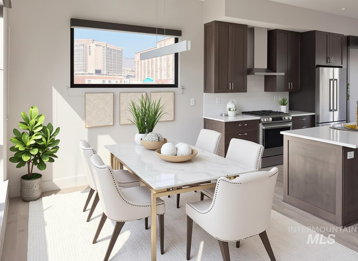 Dining area featuring light wood-type flooring and a view of city