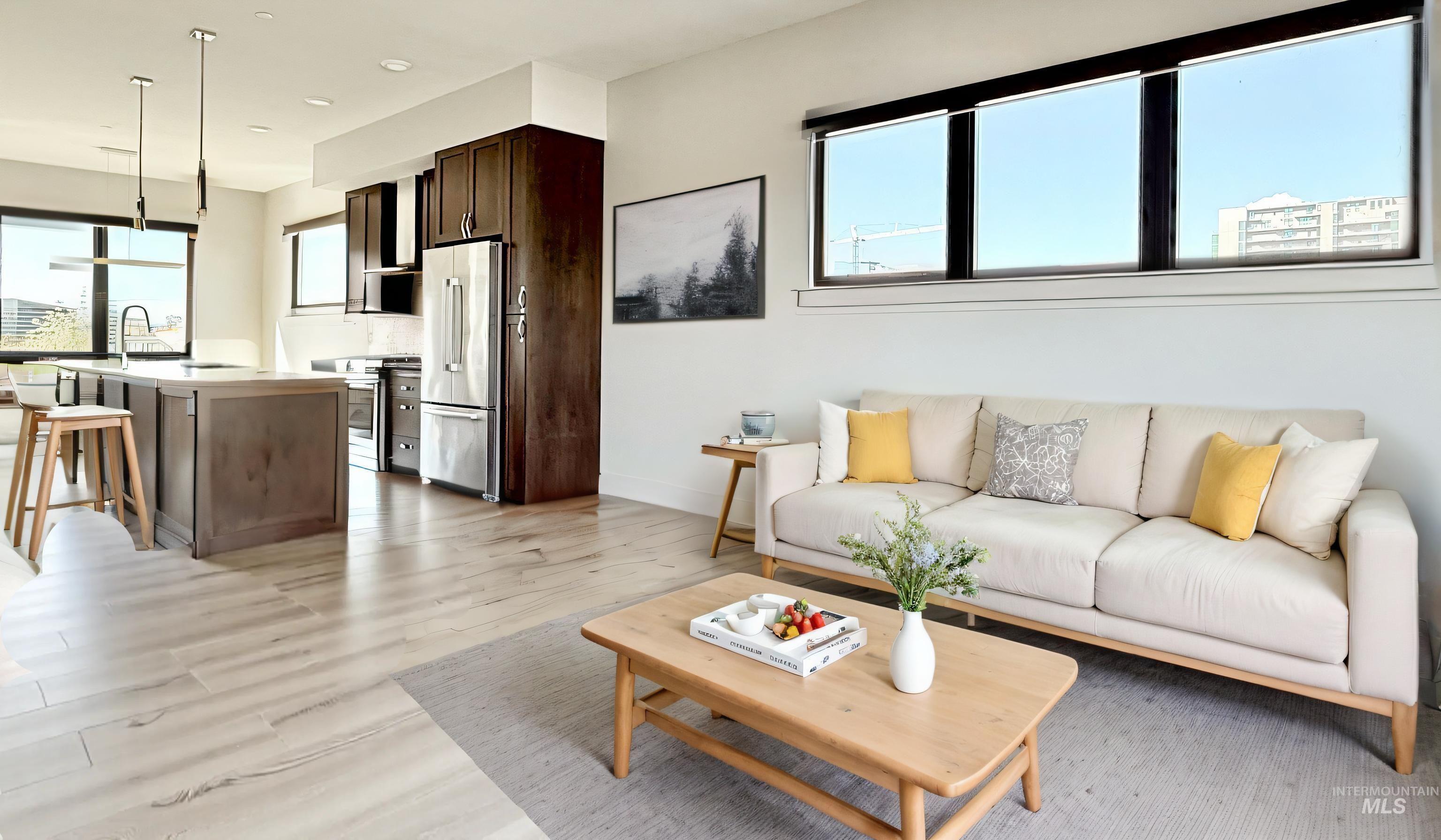 Living area with light wood-style floors and baseboards