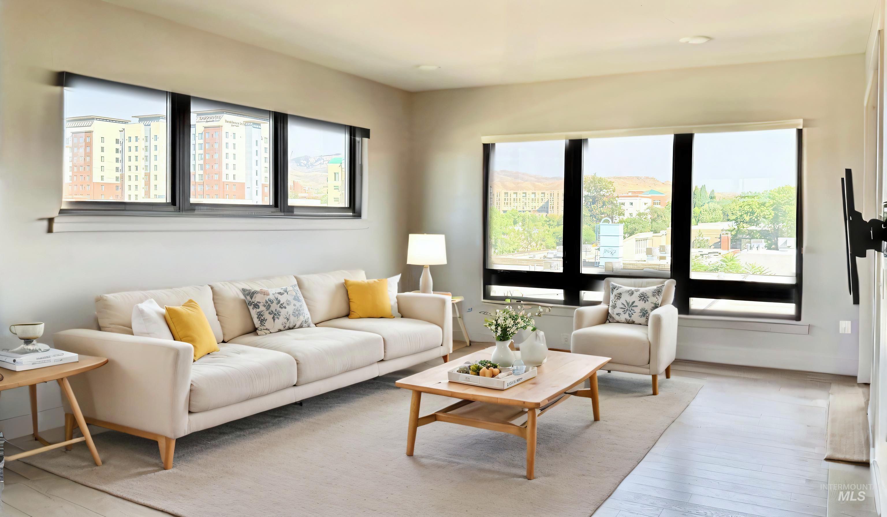 Living area with hardwood / wood-style flooring and baseboards