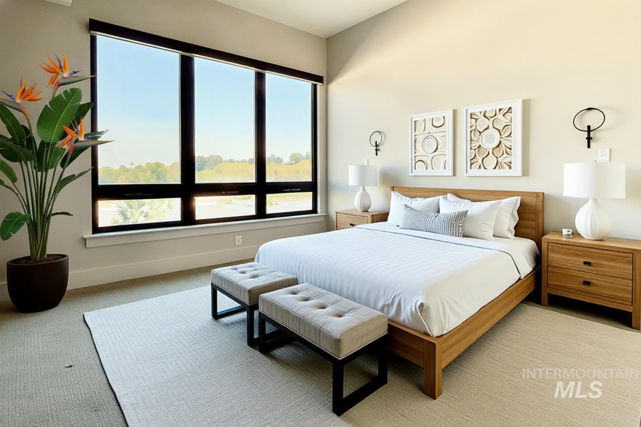 Carpeted bedroom with baseboards