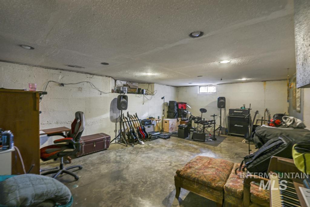 Basement with a textured ceiling