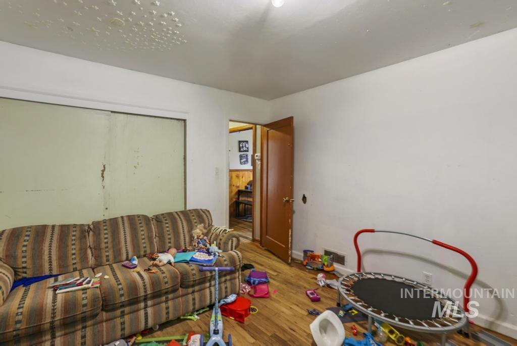 Game room with wood finished floors and baseboards