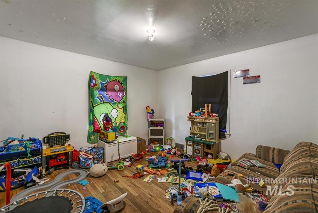 Recreation room with wood finished floors