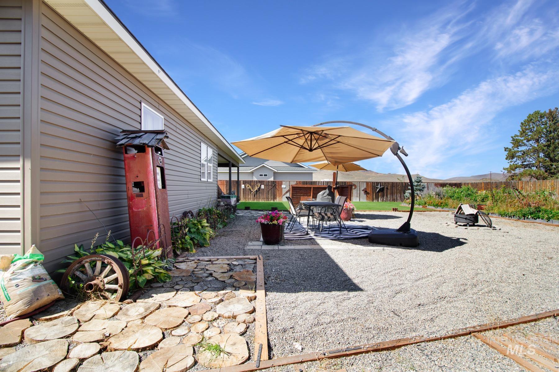 Fenced backyard featuring a patio