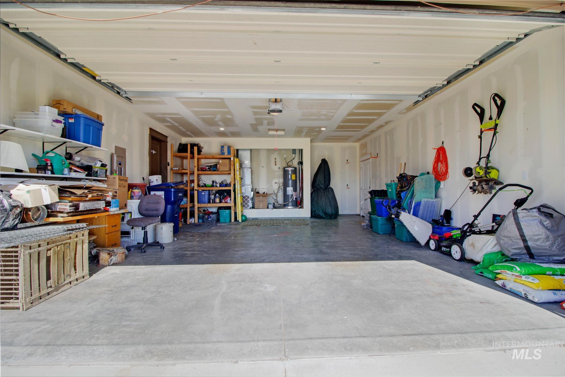 Garage with electric panel and electric water heater