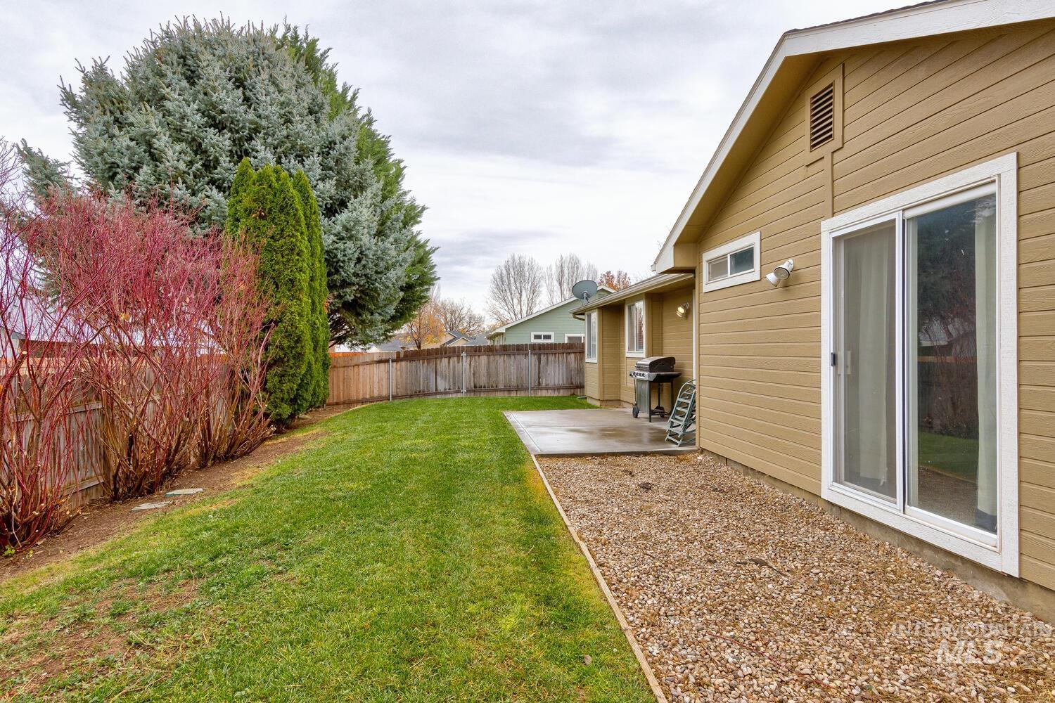 Fenced backyard featuring a patio area