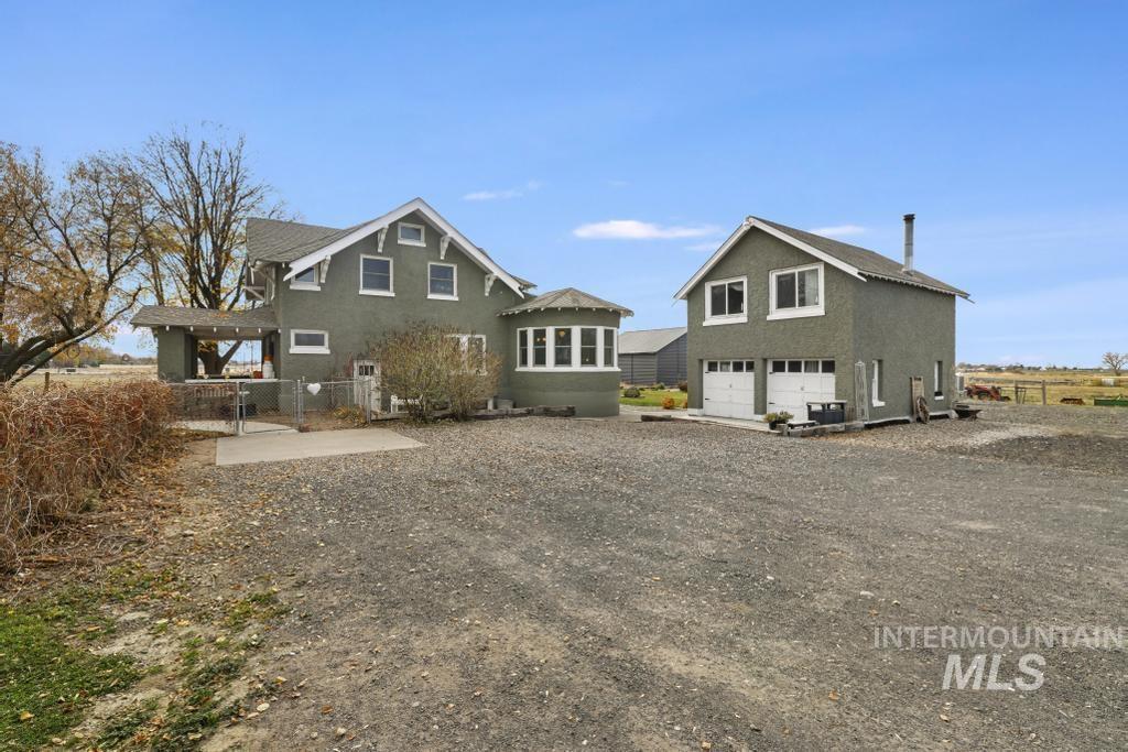Back of property featuring a garage