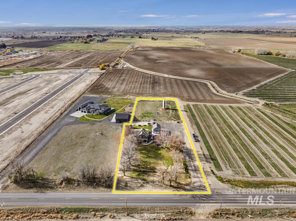 View of rural area with property parcel outlined and extensive farmland