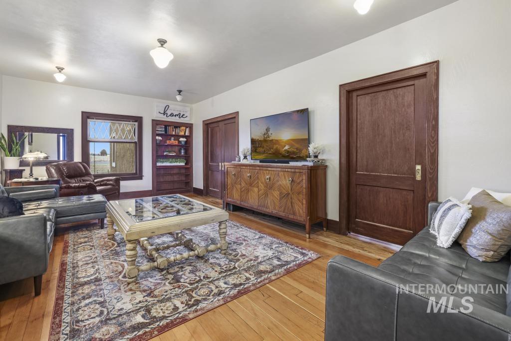 Living area featuring light wood finished floors and baseboards