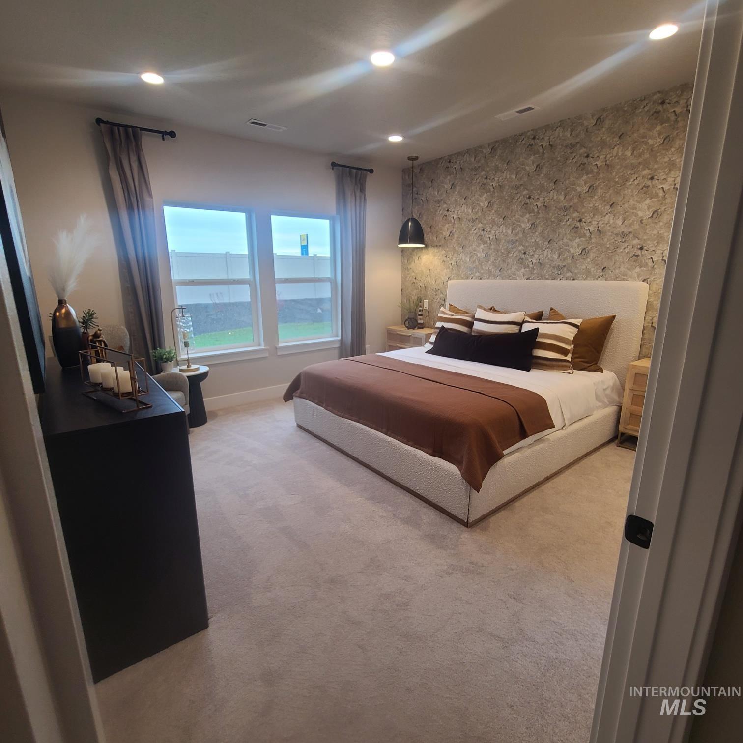 Carpeted bedroom featuring recessed lighting and baseboards