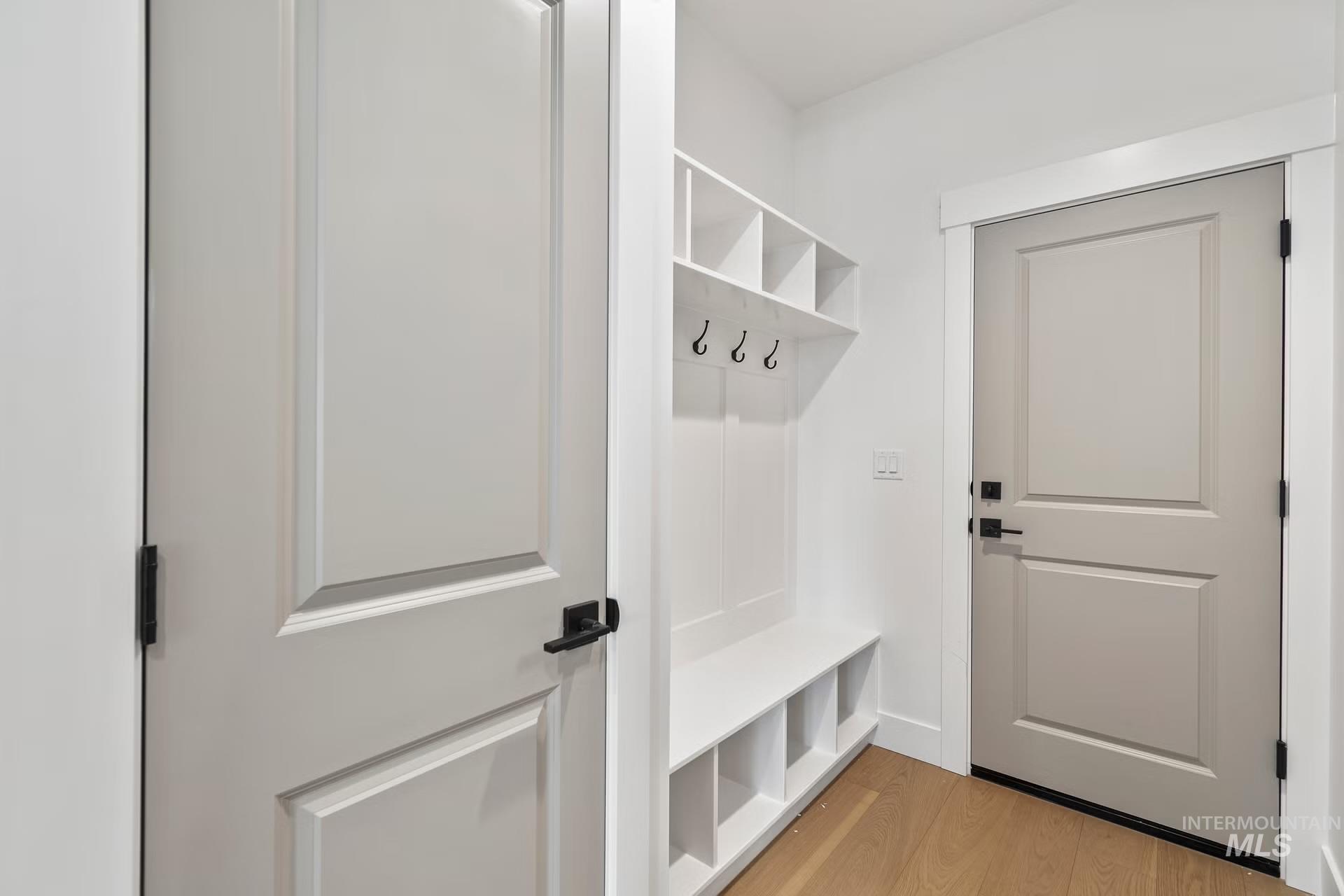Mudroom featuring light wood-style flooring