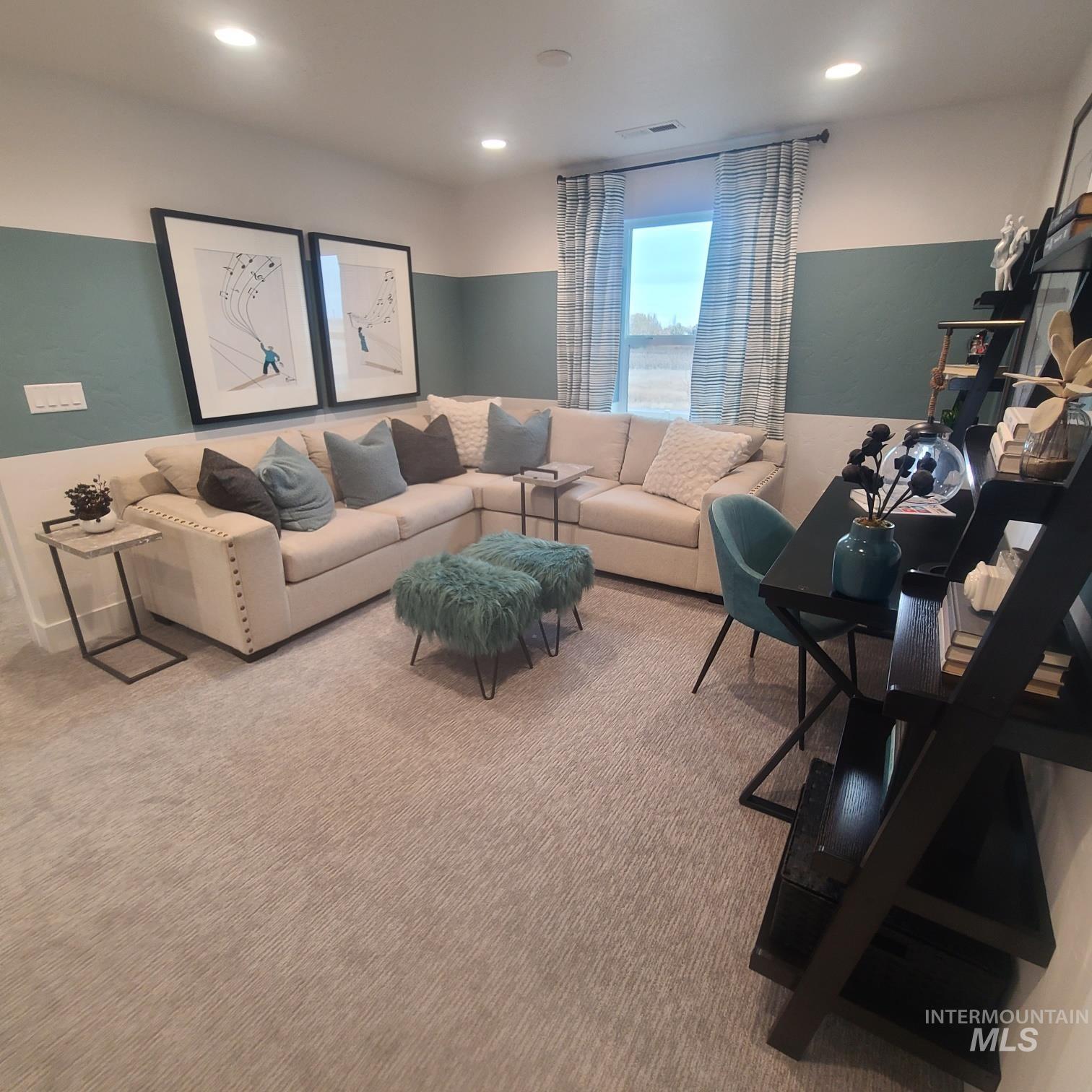 Carpeted living room featuring recessed lighting