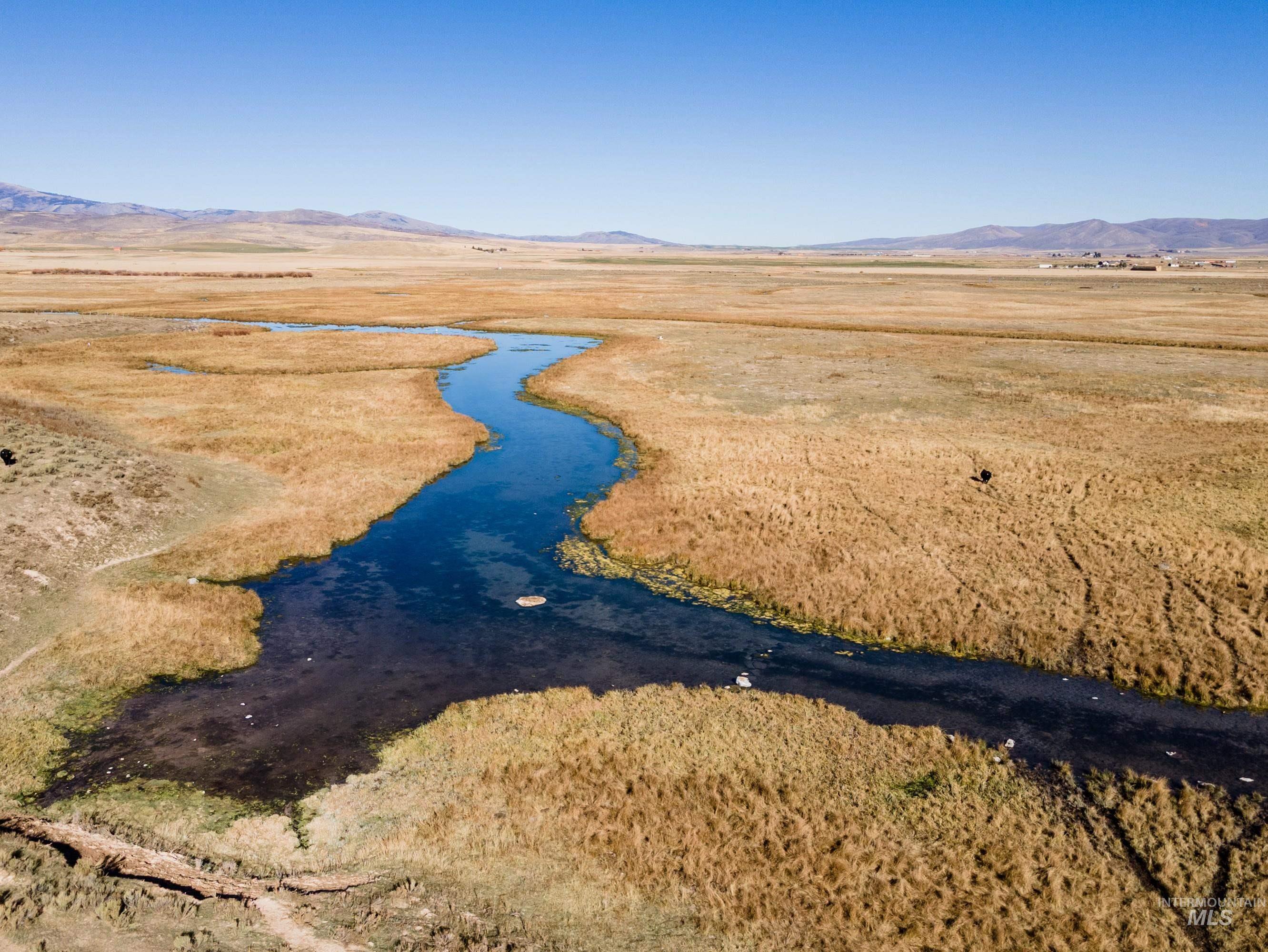 Aerial view of sparsely populated area with a mountain backdrop