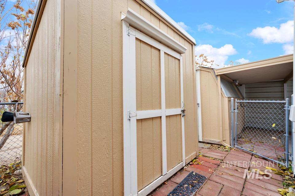 View of shed featuring a gate