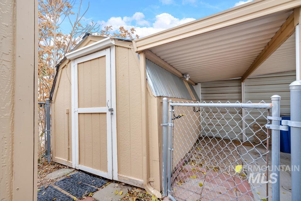 View of shed with a gate